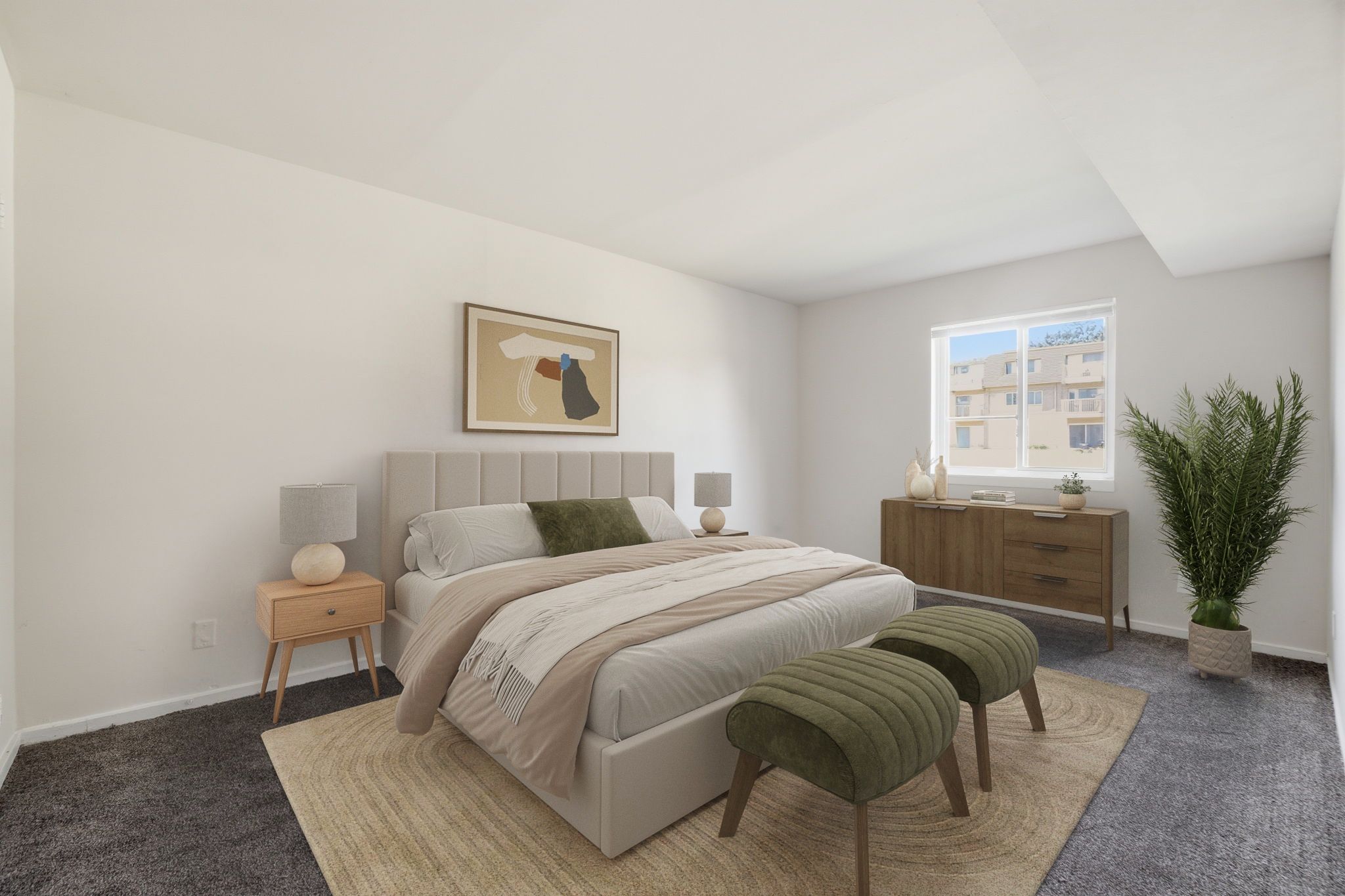 A bedroom with a large bed, a nightstand, a chair, and a potted plant.